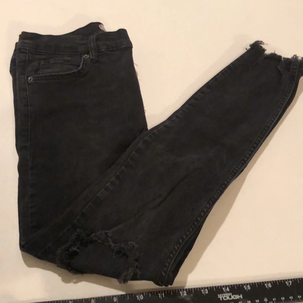 Free People size 27 Black Wash skinny jeans distressed with raw hem